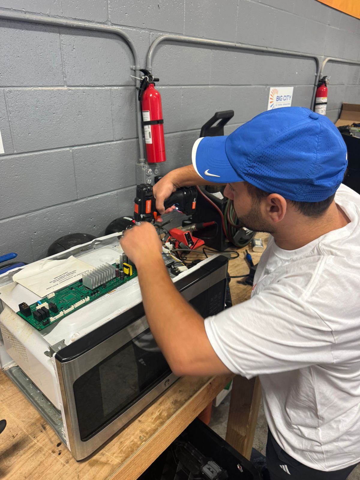 Repix Bay Area appliance repair technician servicing washer